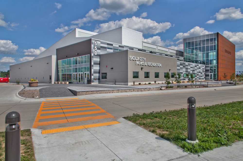 An orange crosswalk leads to the Sioux City Parks & Recreation office.