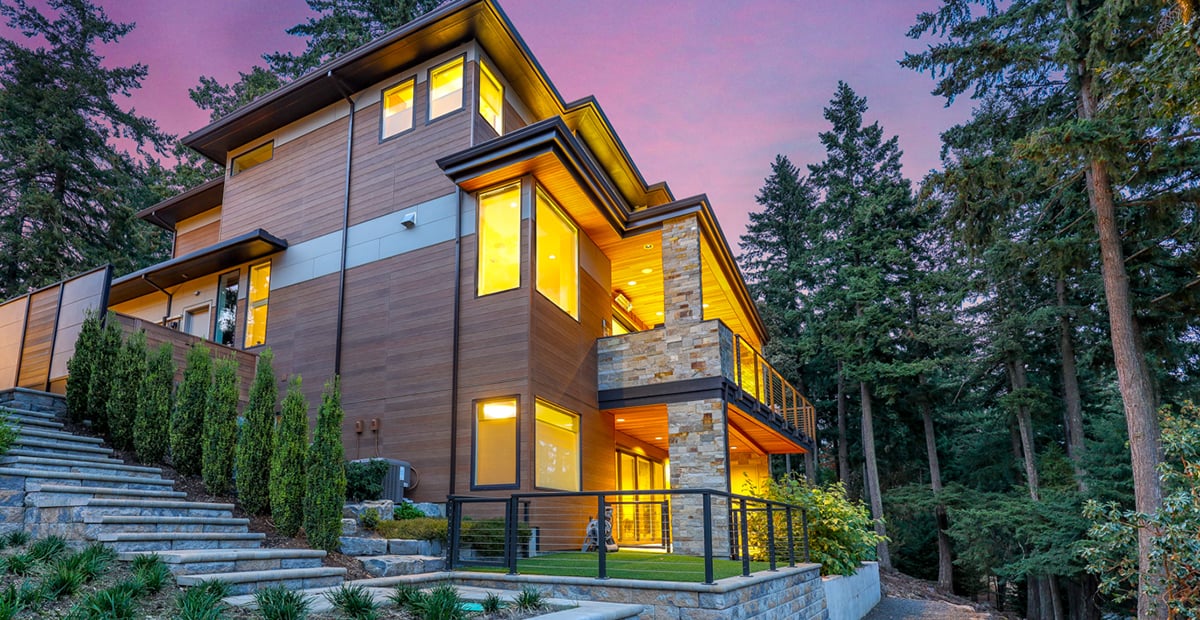 modern house on a mountain top with towering pines
