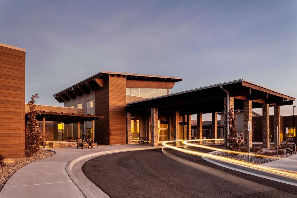 A photo of the Lehi Skilled Nursing Facility in Utah with Nichiha’s EmpireBlock fiber cement cladding in gray and VintageWood fiber cement cladding in cedar.