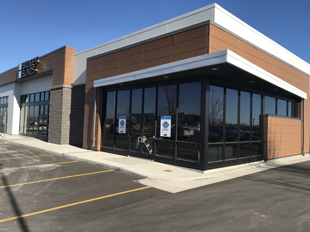 Budget Blinds storefront utilizing Nichiha’s RiftSawn in pecan.