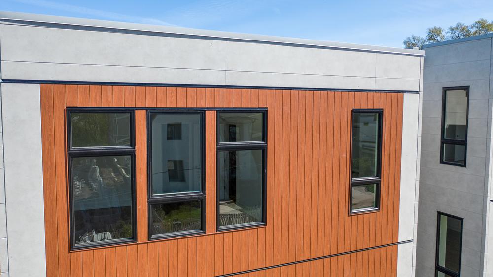 A close up of Nichiha&rsquo;s IndustrialBlock and VintageWood panels on a modern home development in Nashville, TN.