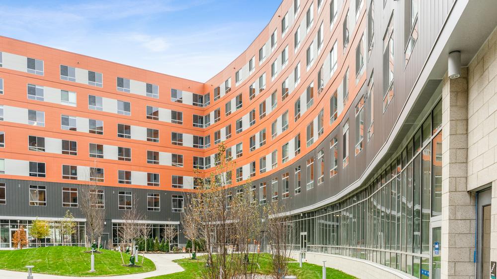 Centric University student housing utilizing Nichiha&rsquo;s Illumination and VintageWood panels.