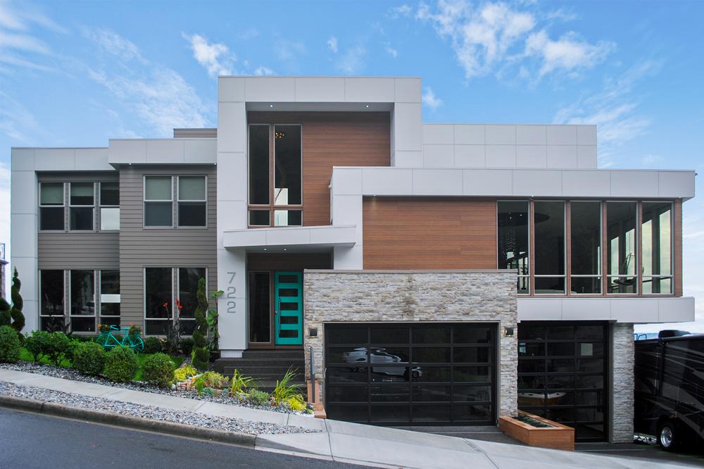 A home with wood-like and brick-like siding on a home utilizing Nichiha’s fiber cement siding.