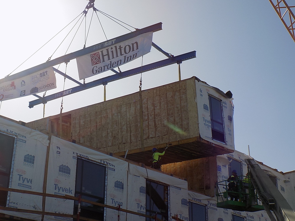A modular construction installation happening with Hilton Garden Inn and Nichiha.