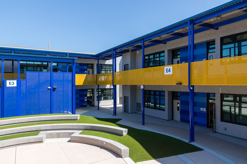 OUSD Madison Park Academy used Nichiha panels to create a space that was functional and fun for learning. There is an outdoor area for students to spend time, as well as multiple breezeways for students to enjoy while walking to different classrooms.