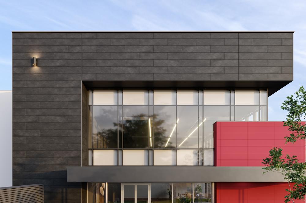 The top corner of a building with dark gray concrete style fiber cement siding surrounding a large window.