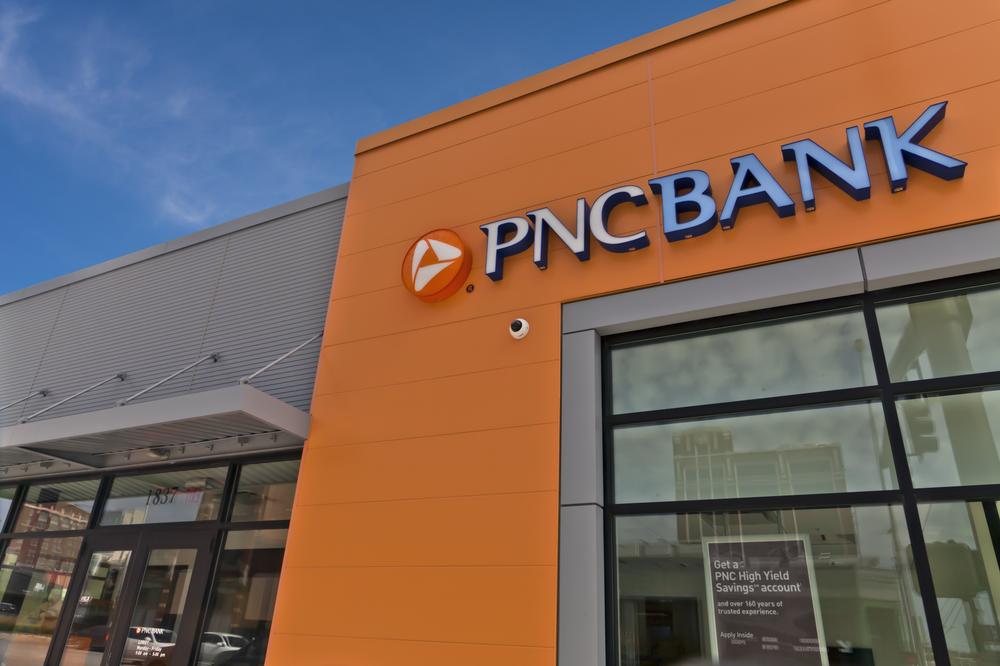 The exterior of PNC Bank utilizing orange and gray Nichiha fiber cement cladding.