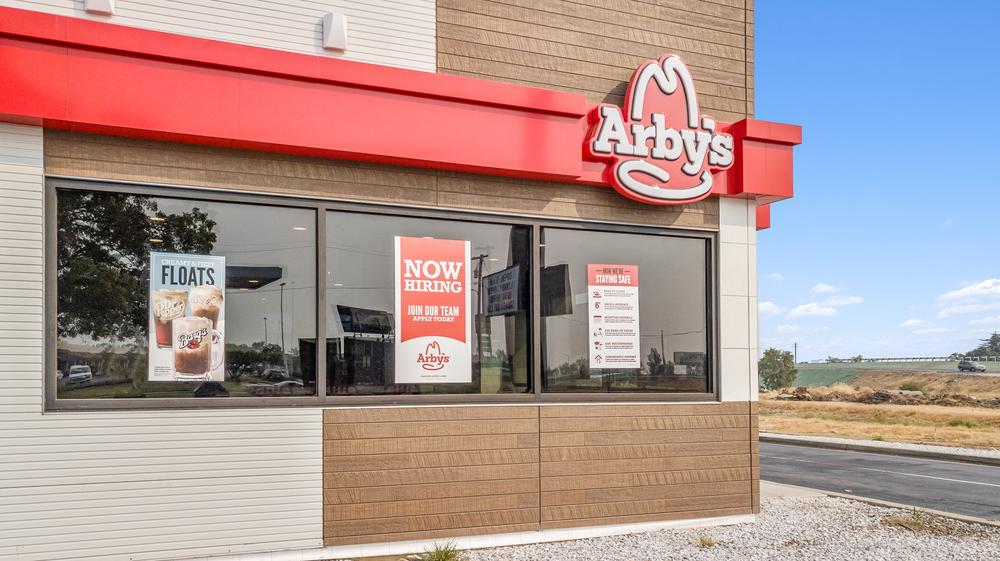 This Arby’s fast-food restaurant utilized Nichiha paneling. There are three signs hanging on the windows, one advertising their floats, one advertising that they’re hiring and the other advertising their health strategy.