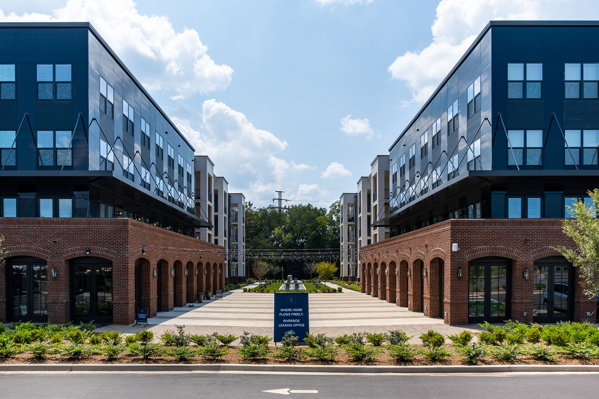 alternate view of riverside complex with buildings mirroring each other across a walkway