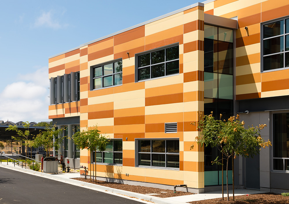 High school with multi-colored orange Illumination panels