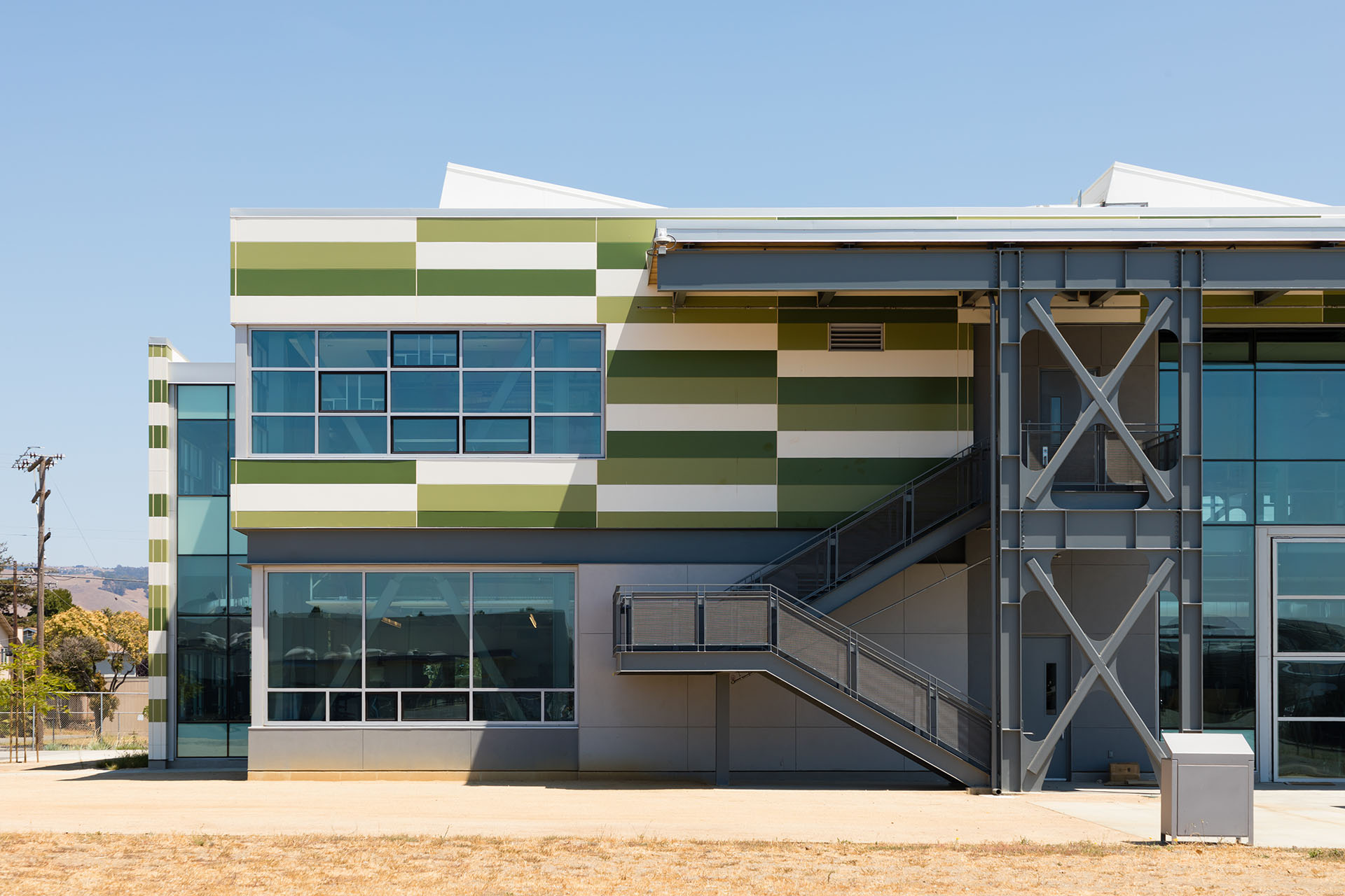 Exterior of Mount Eden High  with multiple green and white Illumination wall panels