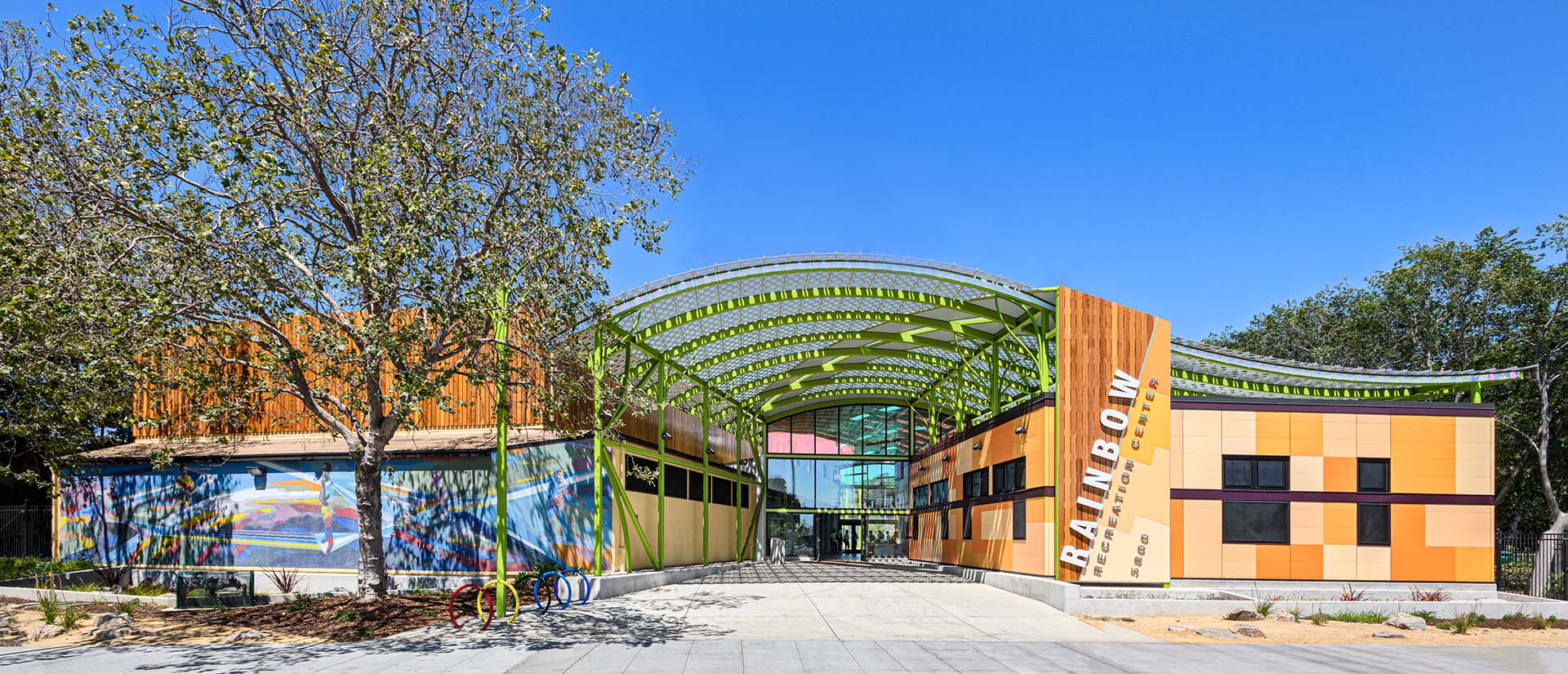 Entrance to Rainbow Recreation Center in California featuring orange Illumination wall panels