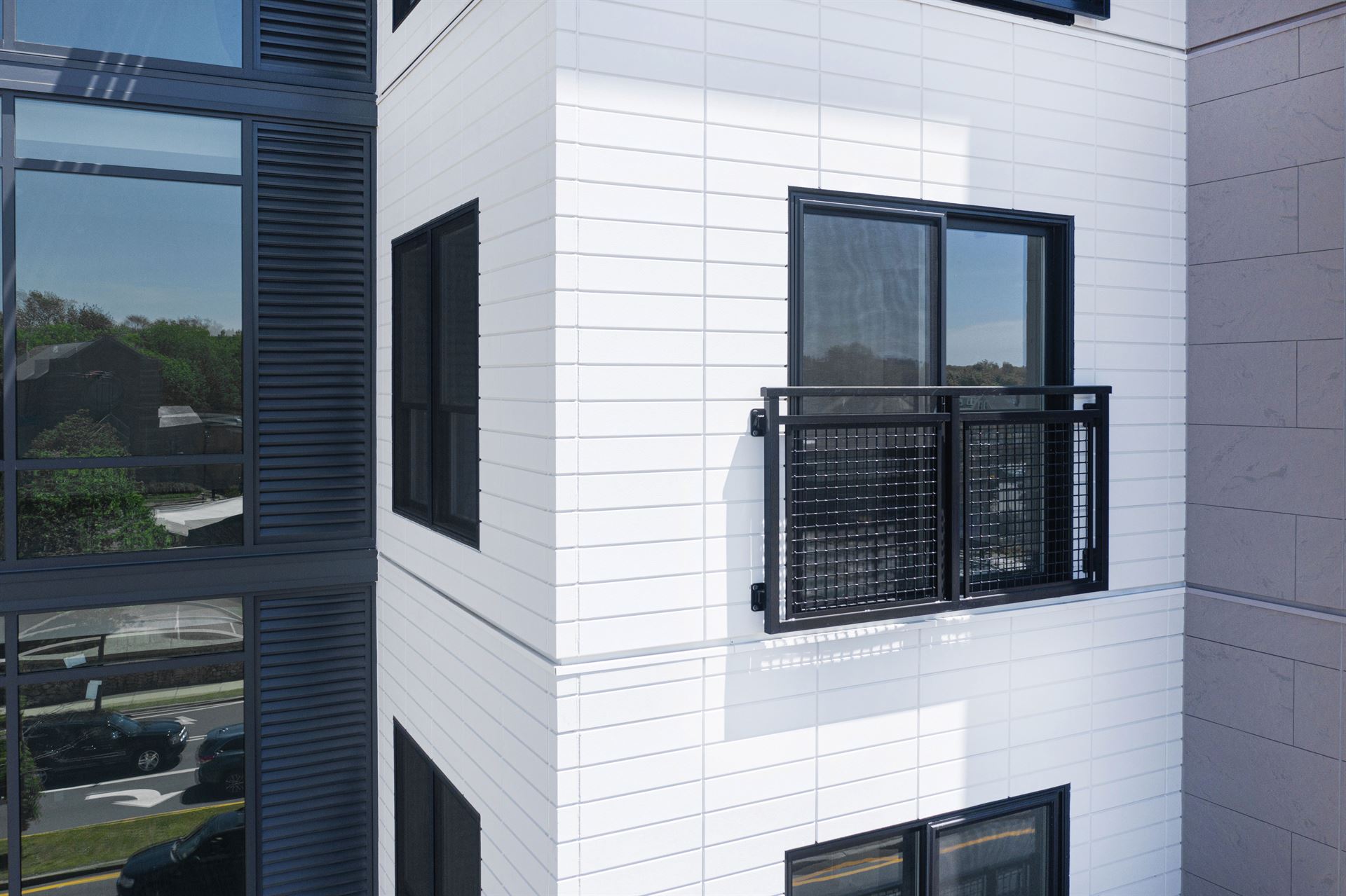 Multifamily building in Massachusetts with Novenary panels in Opal