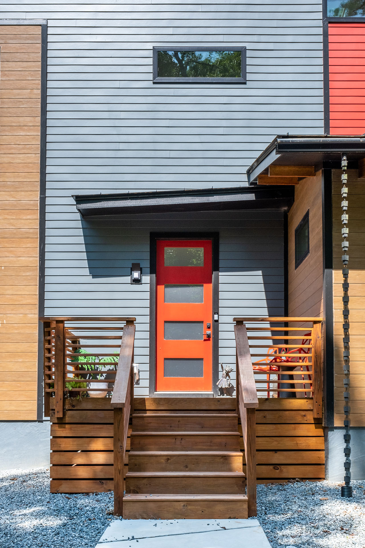 NichiBoard Smooth on modern house with red door
