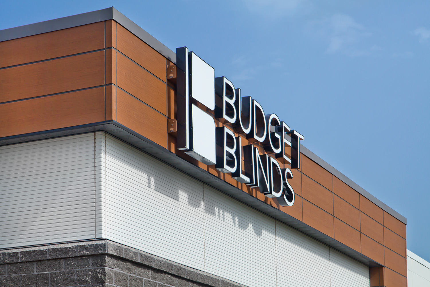 Corner of the Budget Blinds building featuring RiftSawn and Ribbed panels from Nichiha