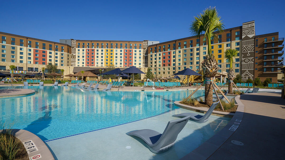 View of the Kalahari pool with lounge chairs and palm trees